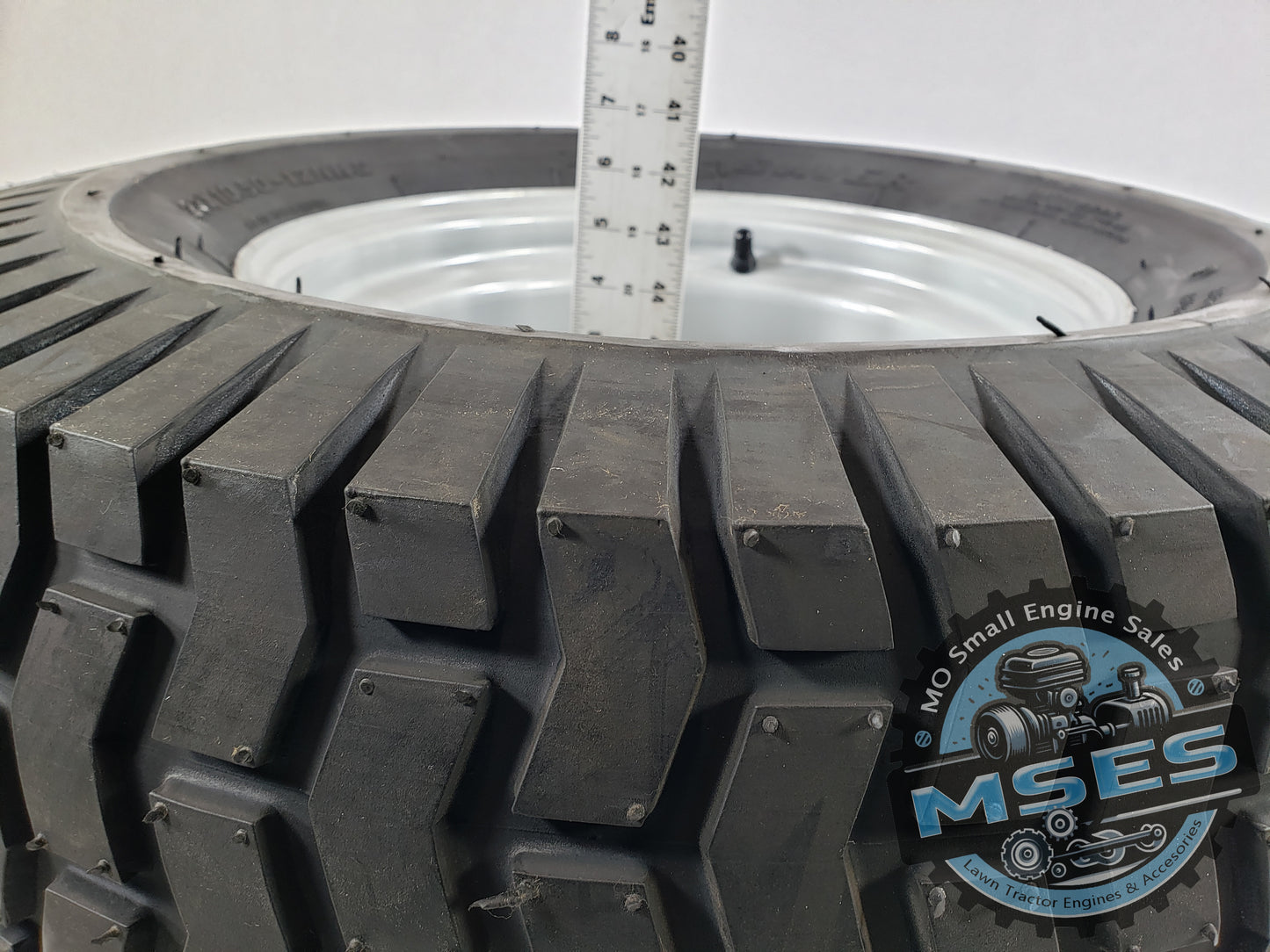 Carlisle 15763 23 x 10.50 - 12 NHS Turf Saver Tread Pneumatic Wheel Assembly