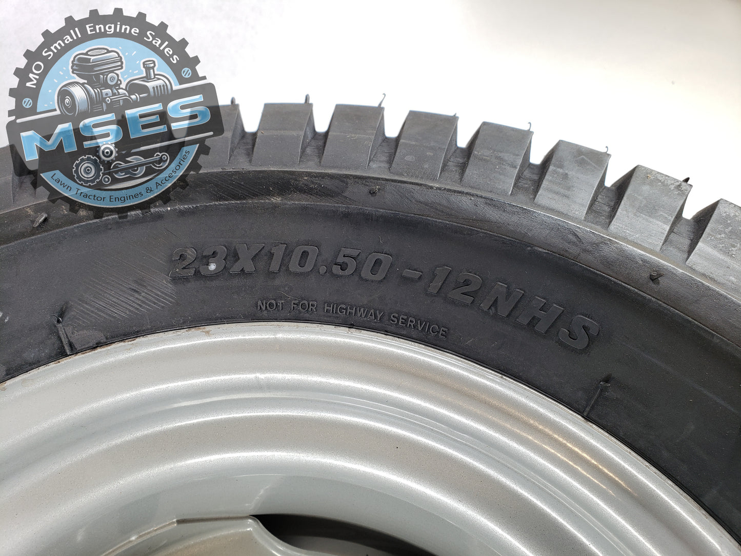 Carlisle 15763 23 x 10.50 - 12 NHS Turf Saver Tread Pneumatic Wheel Assembly